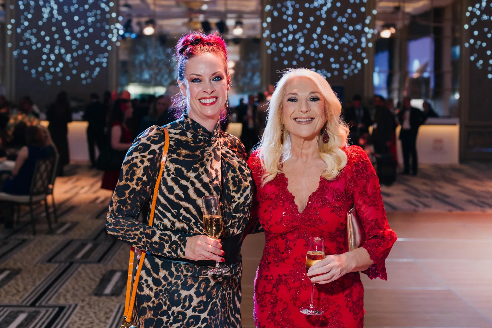 Two guests sharing a smile at an evening reception