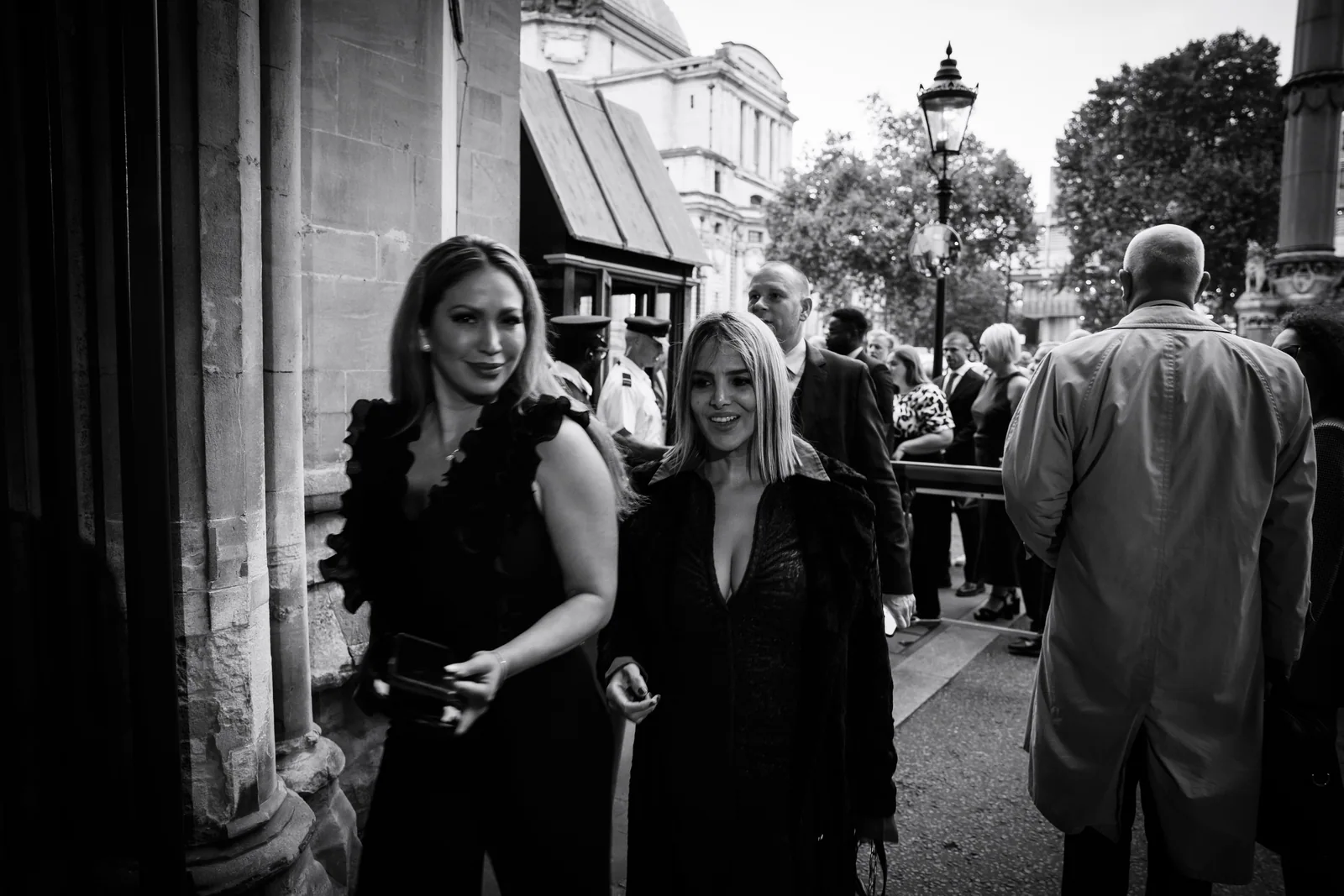 Guests in conversation, photographed in black and white