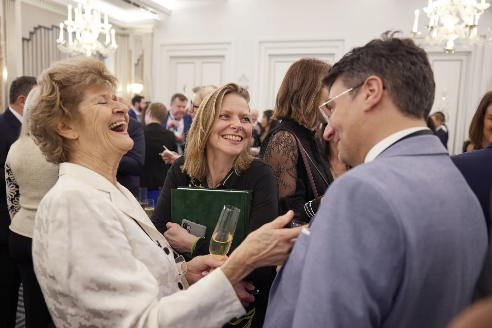 Guests talking at the King Charles III launch