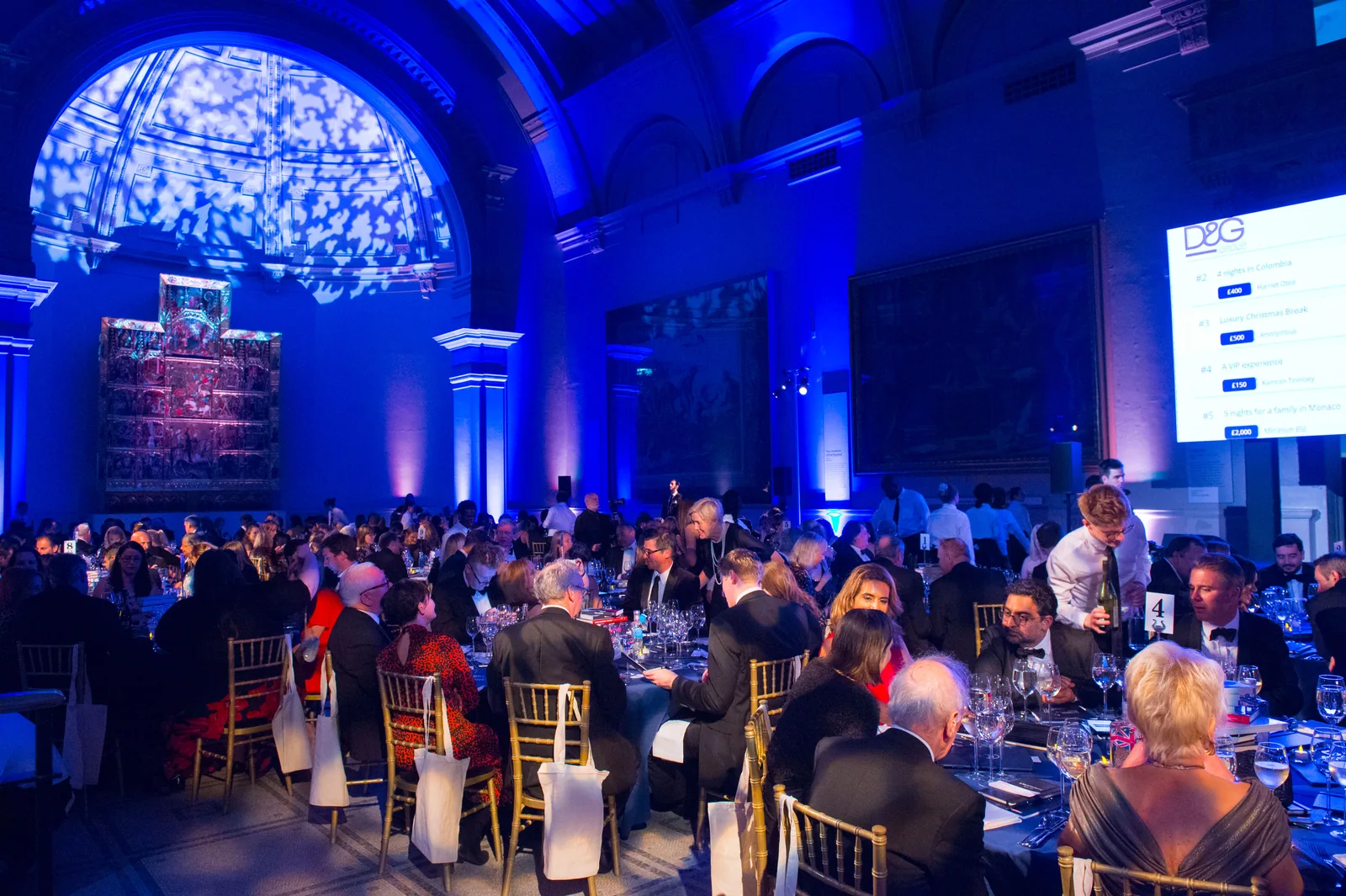 A gala room with atmospheric blue stage lighting
