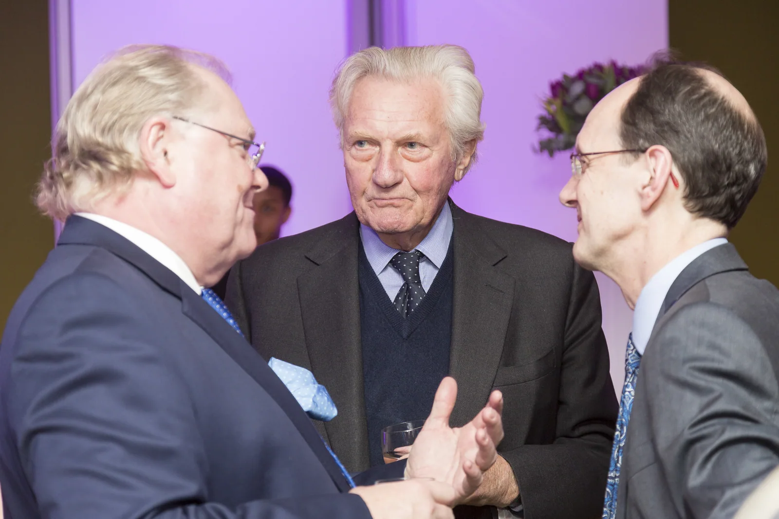 Guests exchanging ideas during a reception