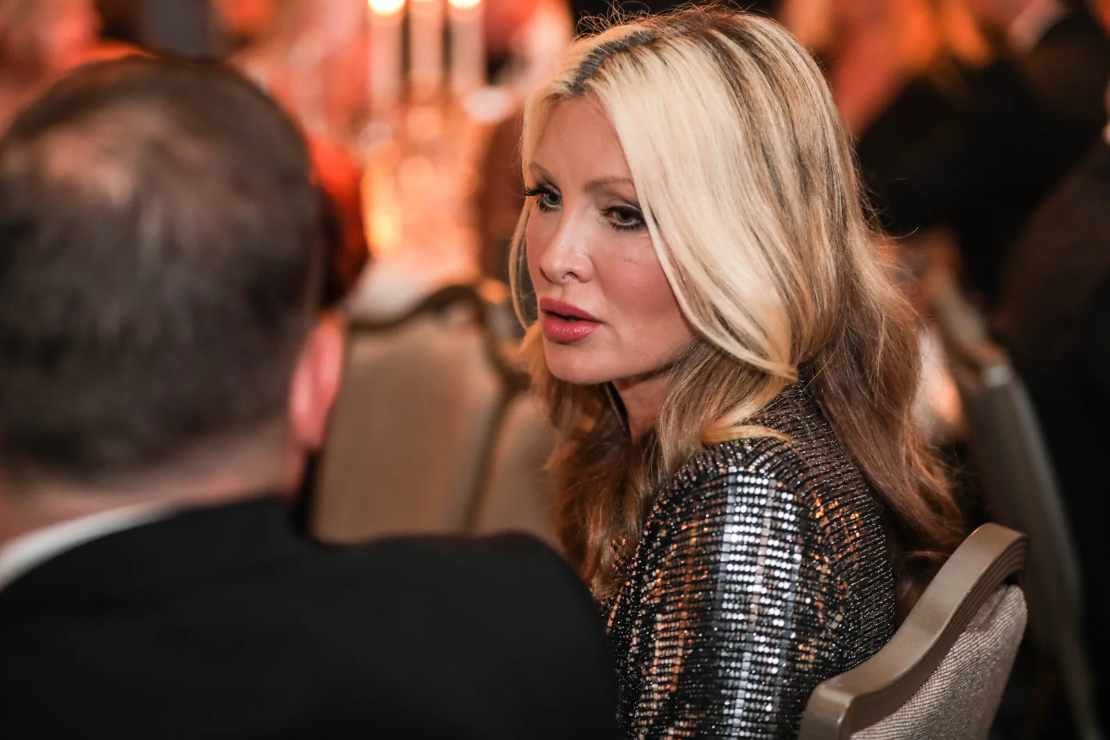 Guests in conversation during an evening event