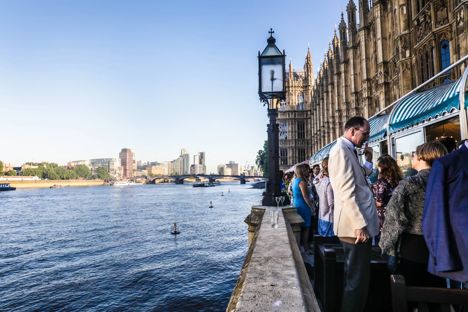 Guests beside the Thames at a London event