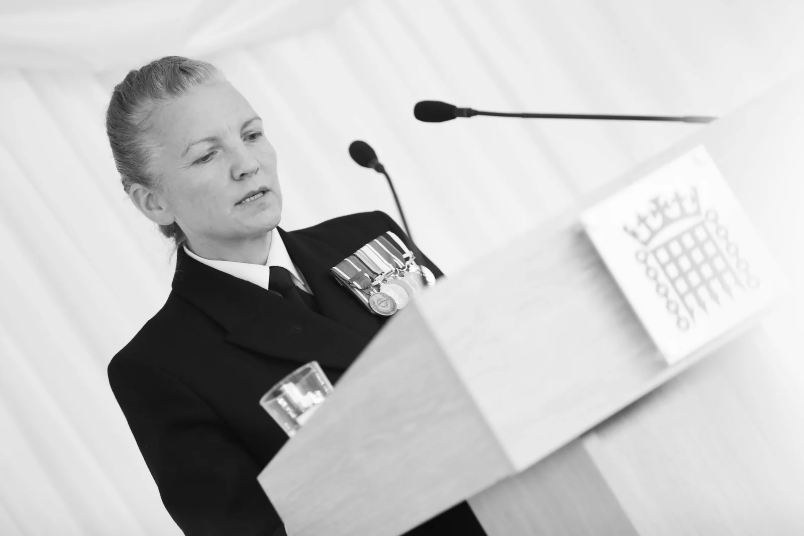 A guest reading a publication, in black and white